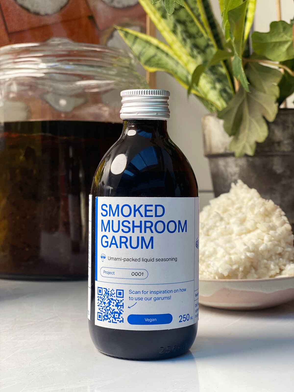 A bottle of the Noma smoked mushroom garum liquid seasoning.