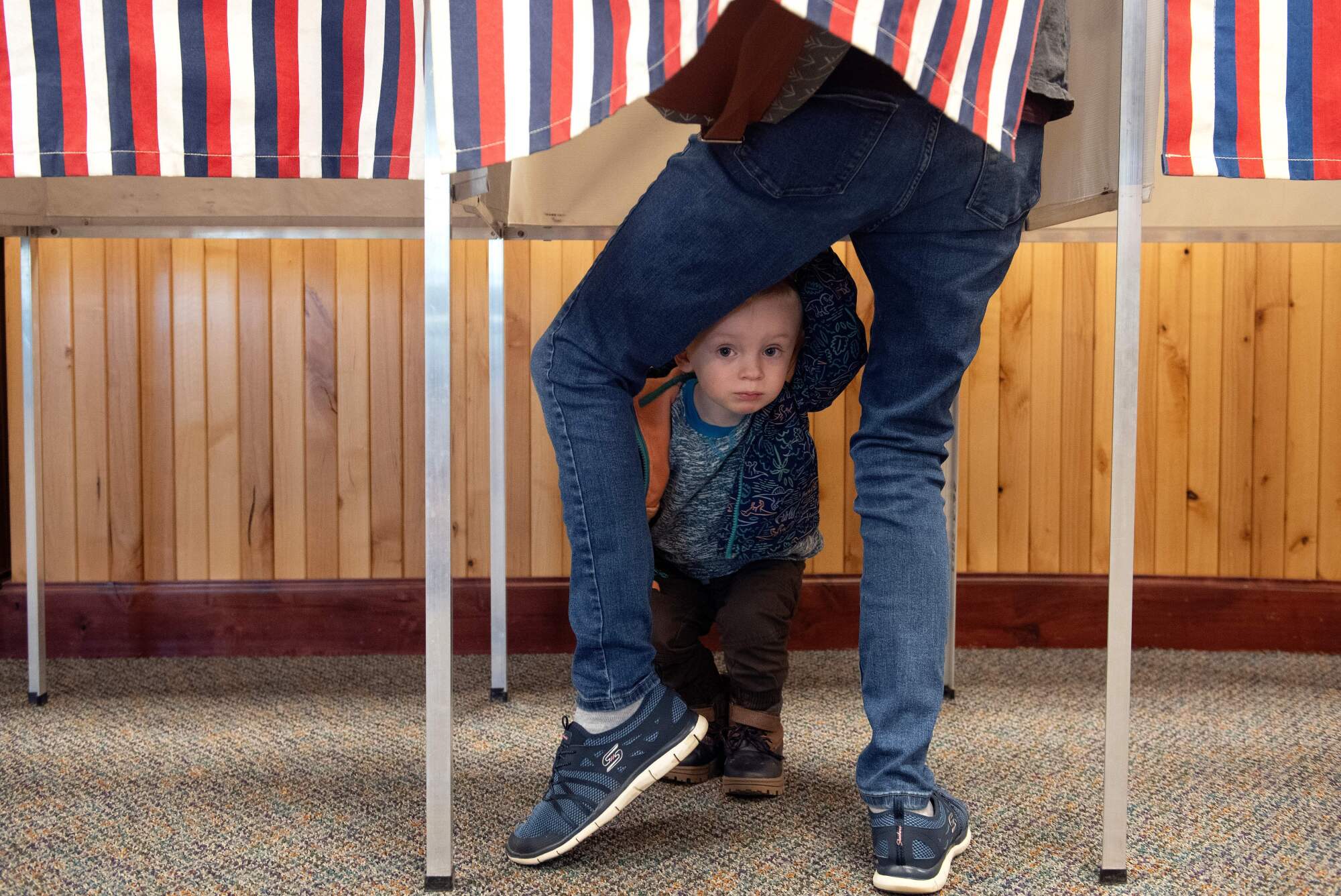 Two-year-old Noah Davenport of Granby, Colo., waits for his mother to cast her ballot at the Granby Town Hall.