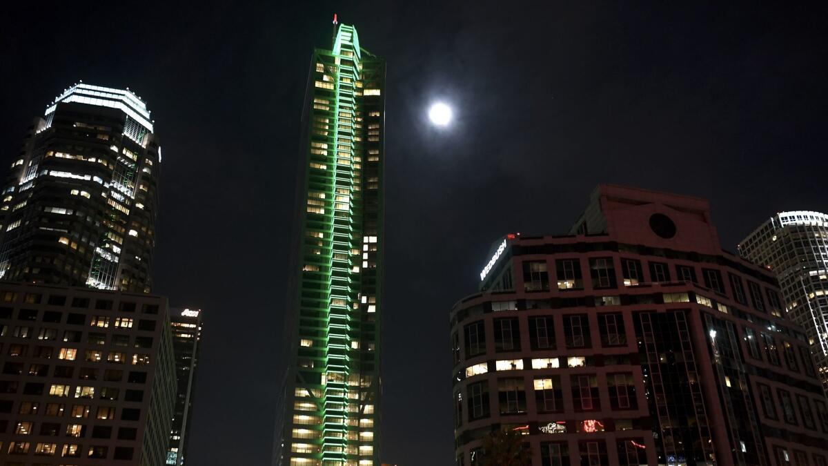 The Wilshire Grand skyscraper in downtown Los Angeles conducts a test lighting in support of the city's bid to host the 2024 Summer Olympics. The green represents one of the Olympic colors.