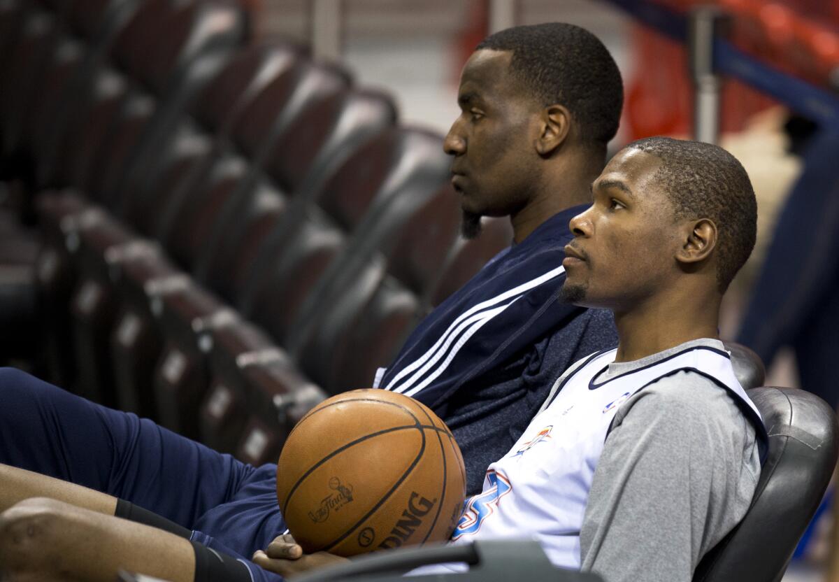 Then-Oklahoma City Thunder teammates Kendrick Perkins, left, and Kevin Durant in 2012.