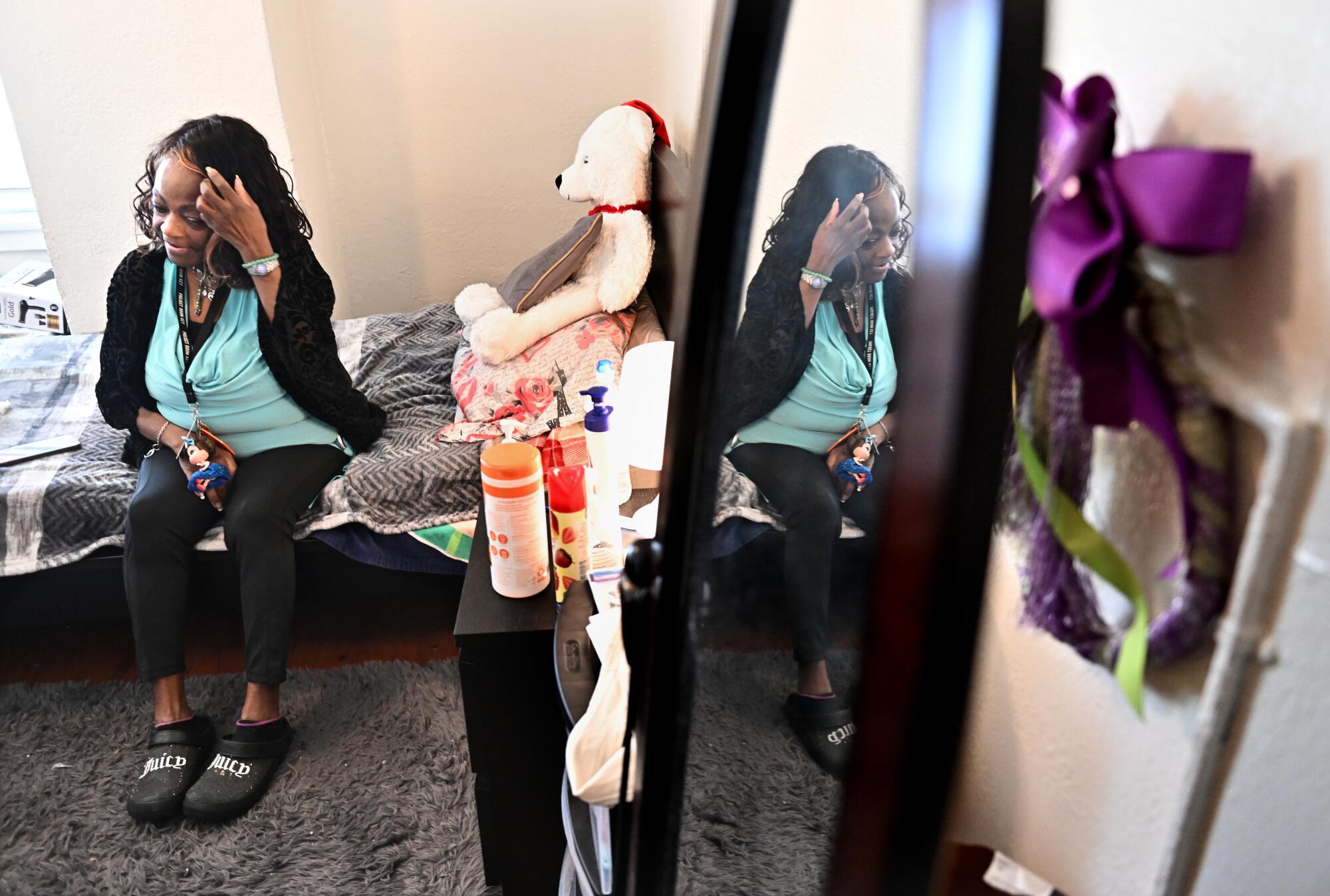 A woman relaxes in her apartment. 