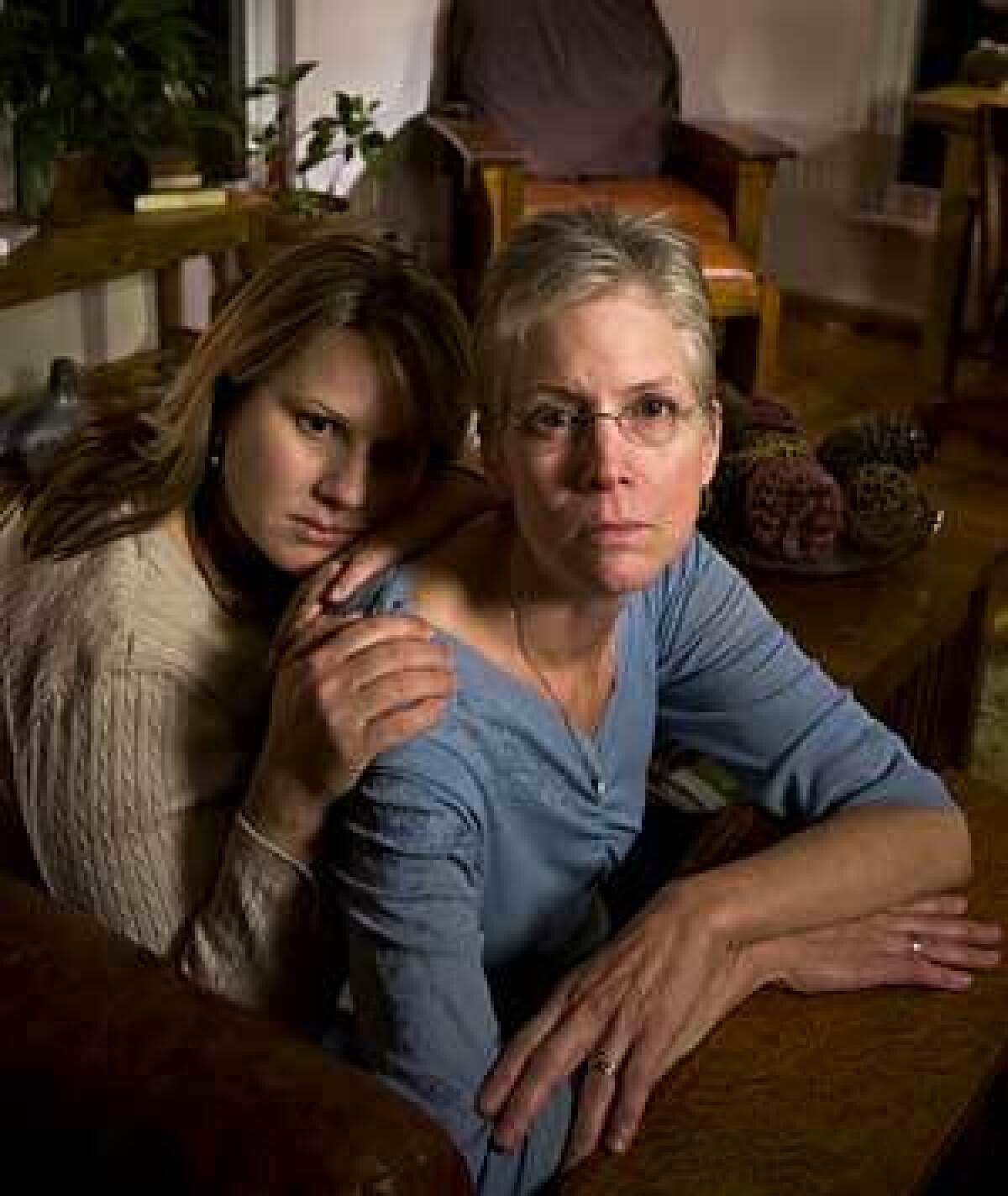 Carrie Thomas comforts her mother, Vickie Burton, whose husband, Steven, died after checking into a Sacramento hospital for treatment of alcohol abuse and depression.