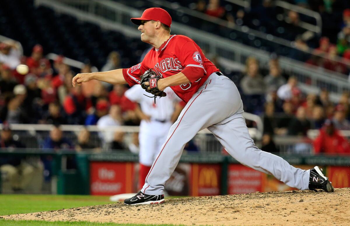 Reliever Joe Smith delivers a pitch during an Angels win over the Washington Nationals on Monday. Smith is looking forward to taking a train from Washington to New York for the team's weekend series against the Yankees.