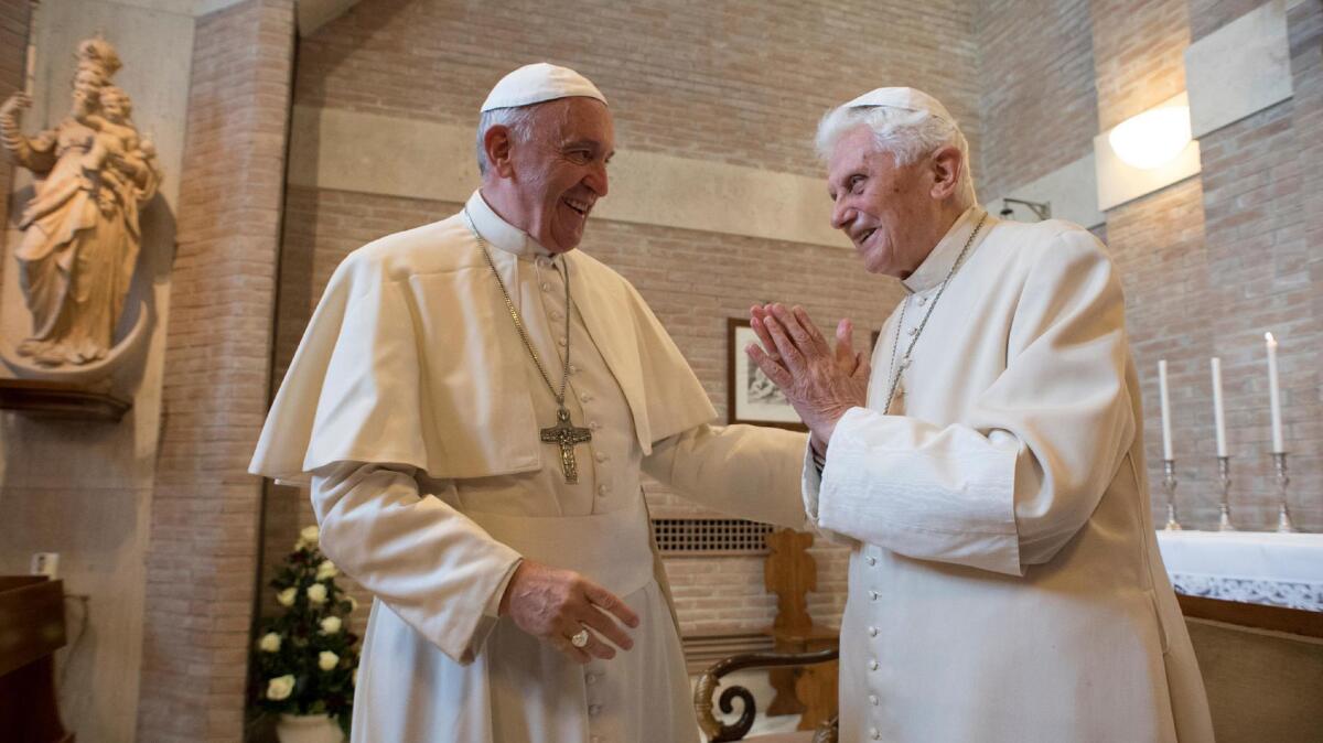 Pope Francis, left, meets with Pope Emeritus Benedict XVI during a meeting with newly nominated cardinals on Nov. 19, 2016, at the Vatican.