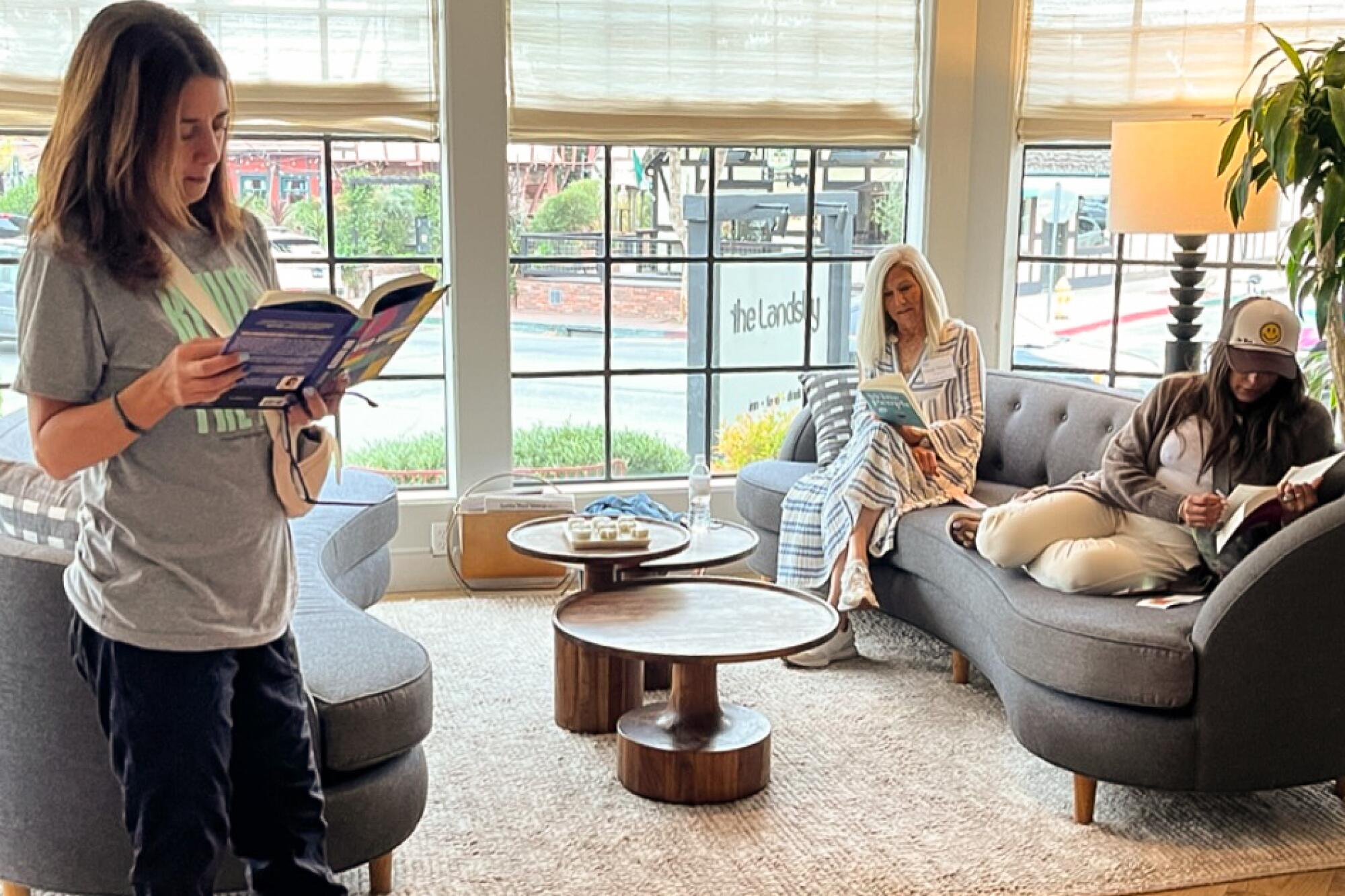 Women reading books in the lobby of the Lansby.