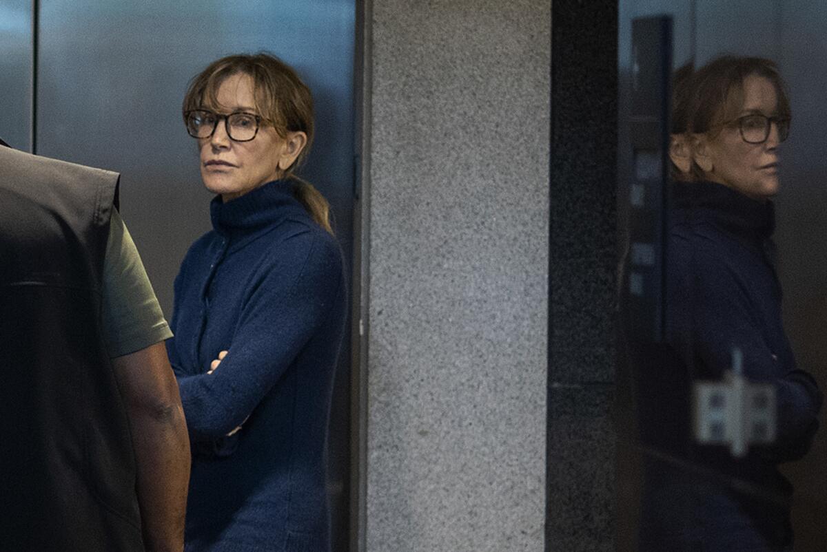 Actress Felicity Huffman is seen inside the Edward R. Roybal Federal Building and U.S. Courthouse in Los Angeles. Huffman, 56, and Lori Loughlin, 54, who starred in “Full House,” are charged with conspiracy to commit mail fraud and honest services mail fraud.