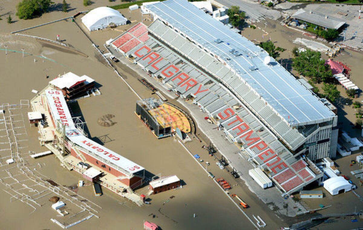 Aerial photo of the Calgary Stampede grounds immersed in water during heavy flooding in Calgary, Canada.