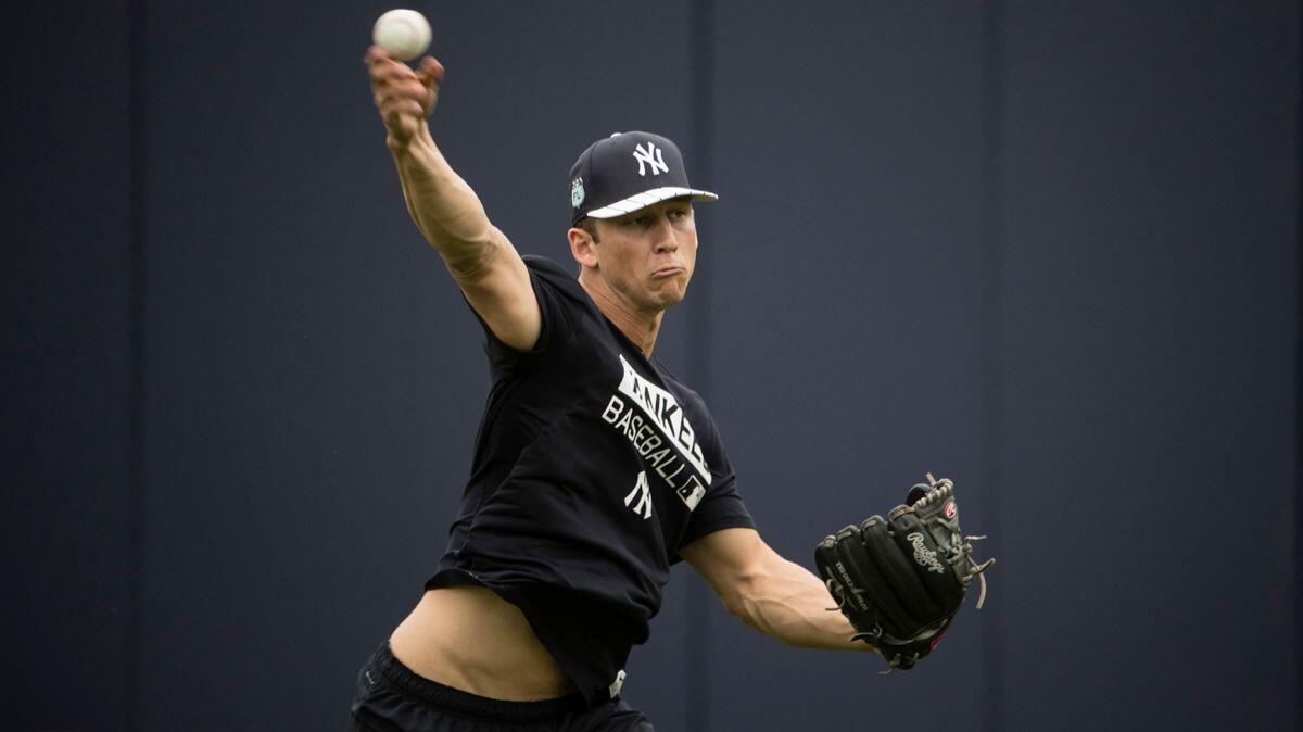 New York Yankees pitcher James Kaprielian throws during a spring training workout on Feb. 14 in Tampa, Fla.