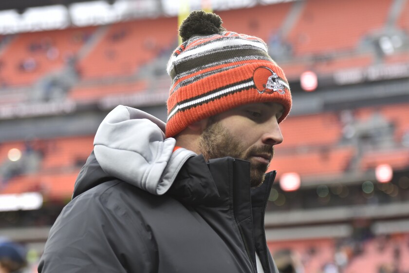 Cleveland Browns quarterback Baker Mayfield walks off the field after the Browns defeated the Cincinnati Bengals 21-16 in an NFL football game, Sunday, Jan. 9, 2022, in Cleveland. (AP Photo/David Richard)