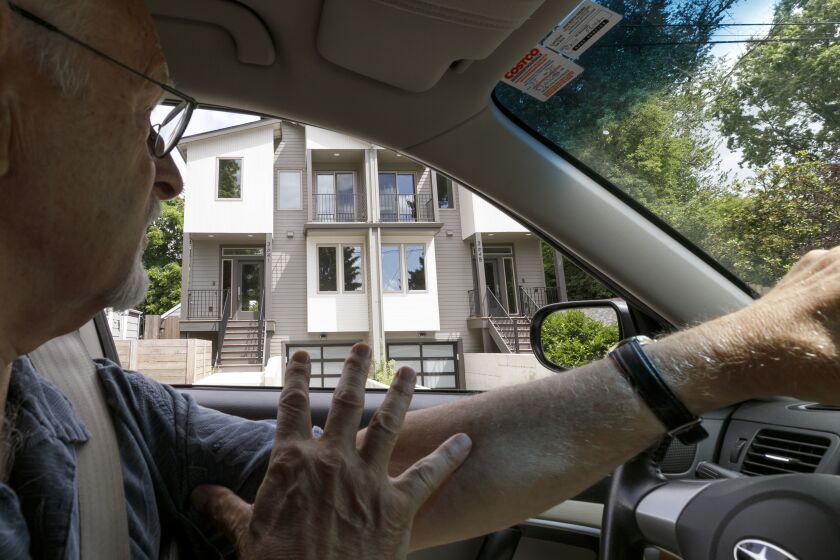 PORTLAND OREGON JULY 11, 2019 -- Rod Merrick, president of the Eastmoreland Neighborhood Association, drives through SE Portland, looking at new multiple family dwellings constructed in the neighborhoods, July 11, 2019. Oregon's Legislature passed bills this year to cap rents and allow fourplexes on sites the currently only allow single-family homes. (Kristyna Wentz-Graff / For The Times)