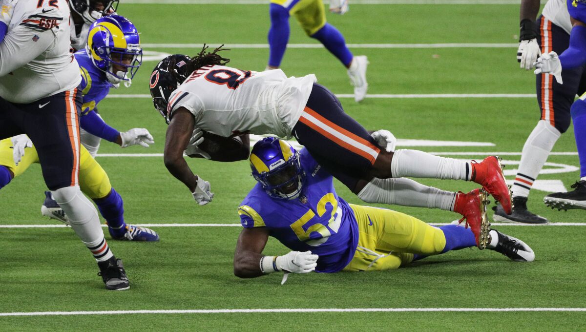The Rams' Terrell Lewis (52) stops Chicago's Cordarrelle Patterson (84) short of a first down on a key fourth-down play.