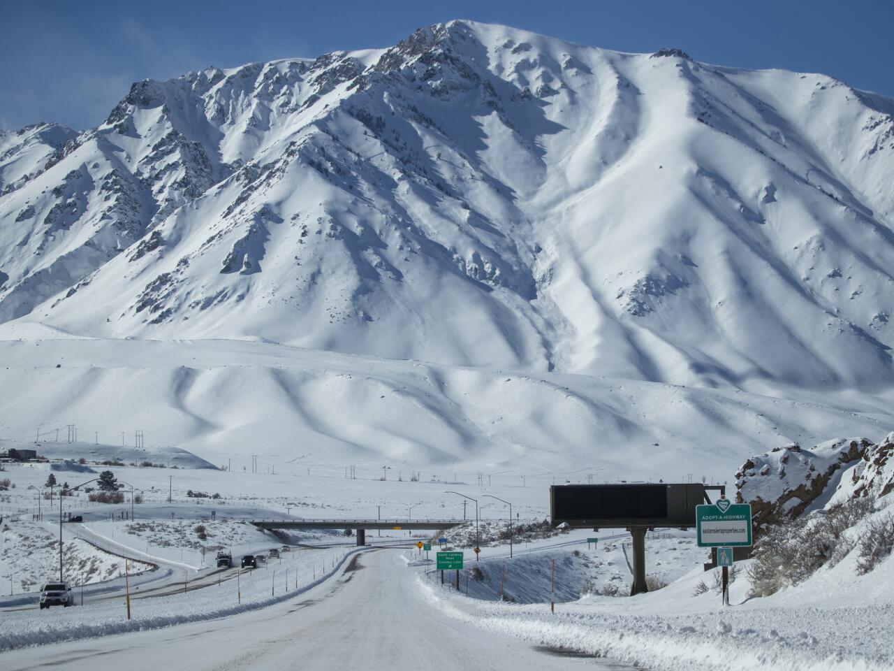 Snow blankets Highway 395 and the Eastern Sierra Nevada Mountains near Crowley Lake.