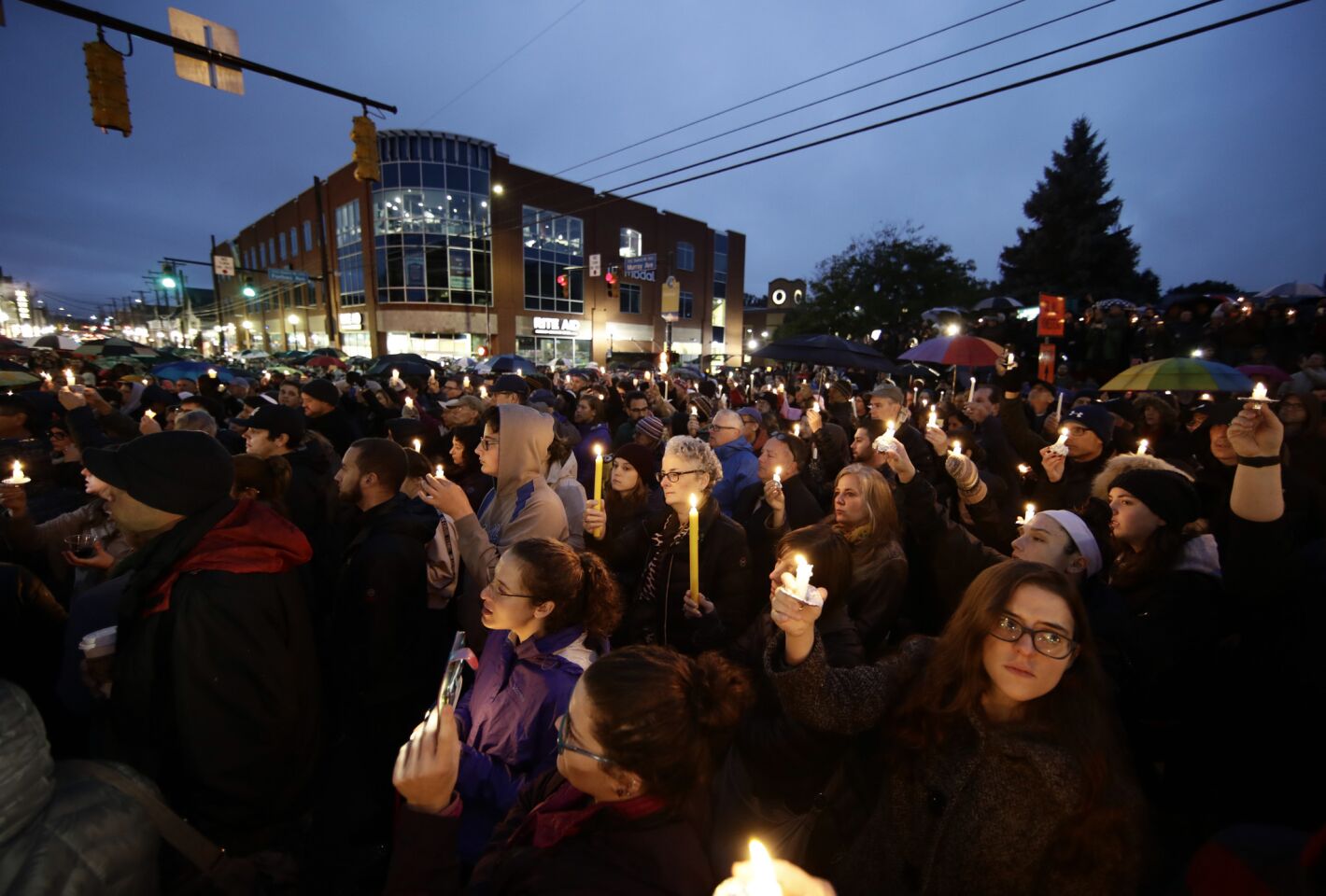 People hold candles as they gather for a vigil in the aftermath of a deadly shooting at the Tree of Life synagogue in the Squirrel Hill neighborhood of Pittsburgh on Oct. 27, 2018.