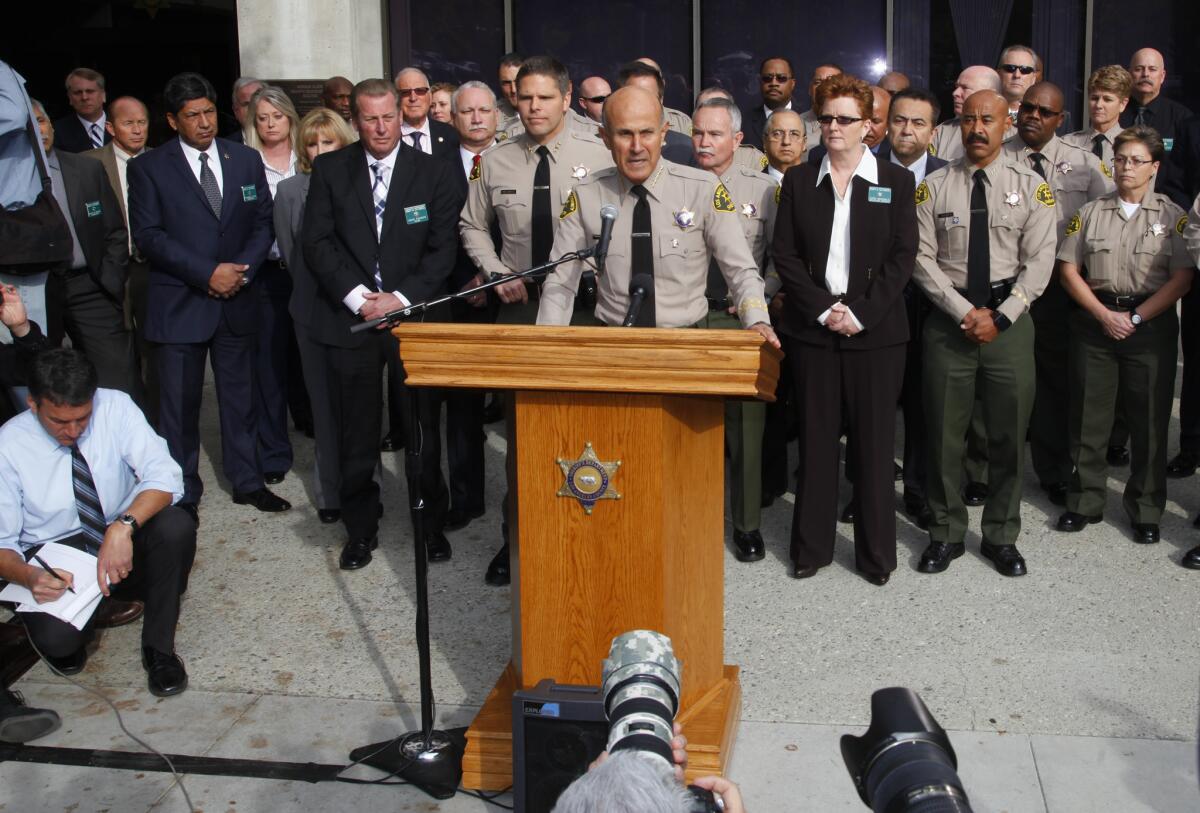 With his command staff standing behind him, L.A. County Sheriff Lee Baca announced Tuesday that he will not seek a fifth term and will instead retire at the end of January.