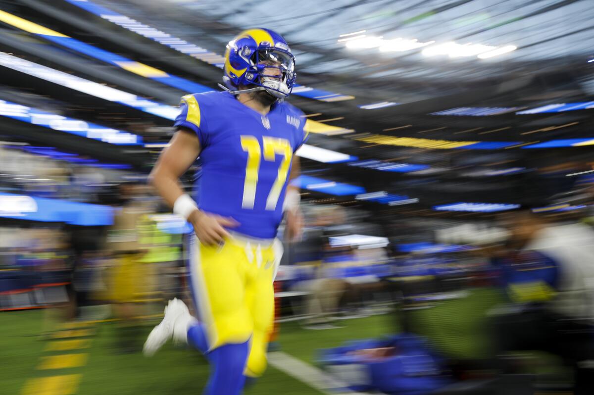 Rams quarterback Baker Mayfield runs on to the field before a win over the Las Vegas Raiders on Dec. 8.