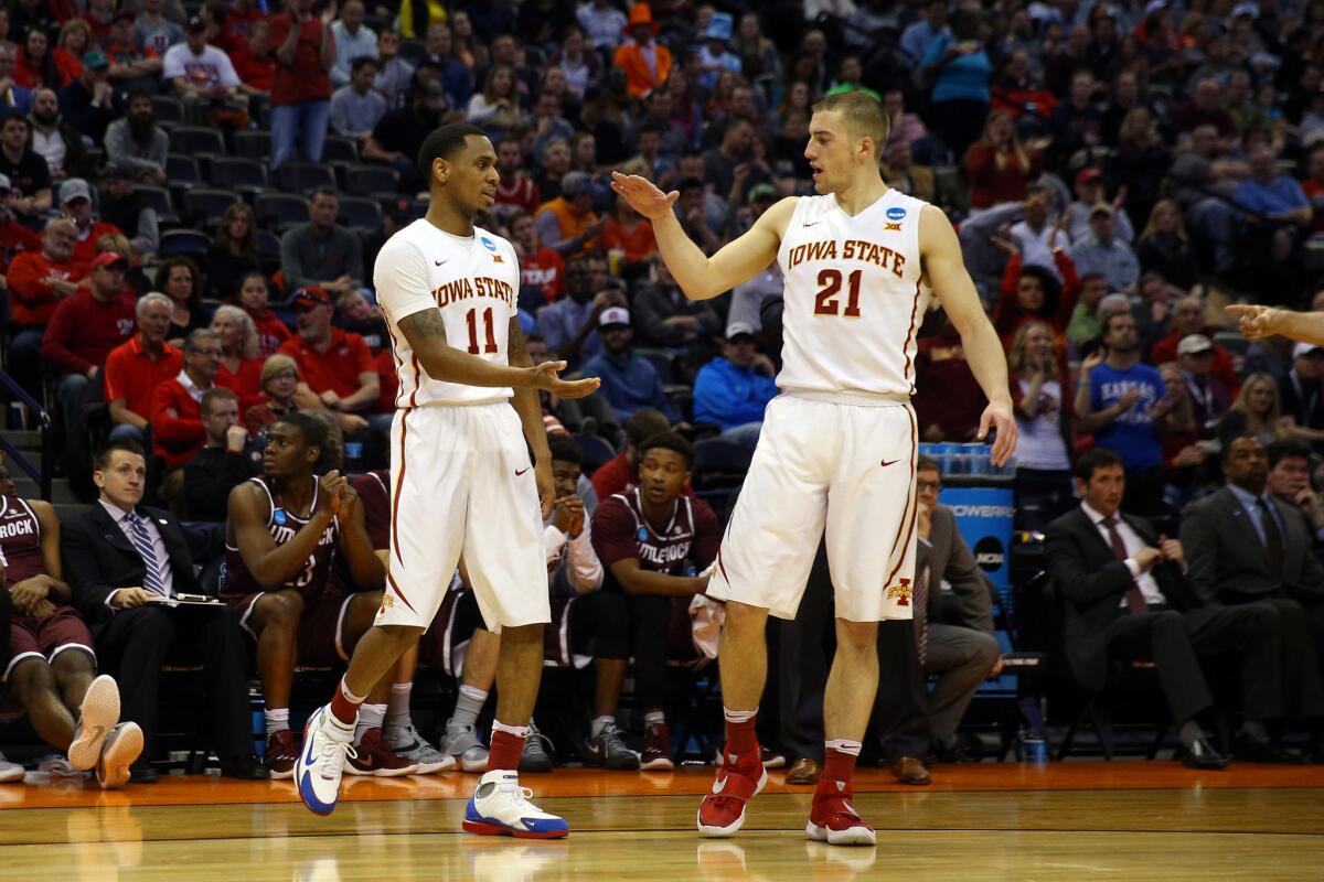 Iowa State's Monte Morris (11) celebrates with teammate Matt Thomas (21) during the first half of an NCAA tournament game against Little Rock on March 19.