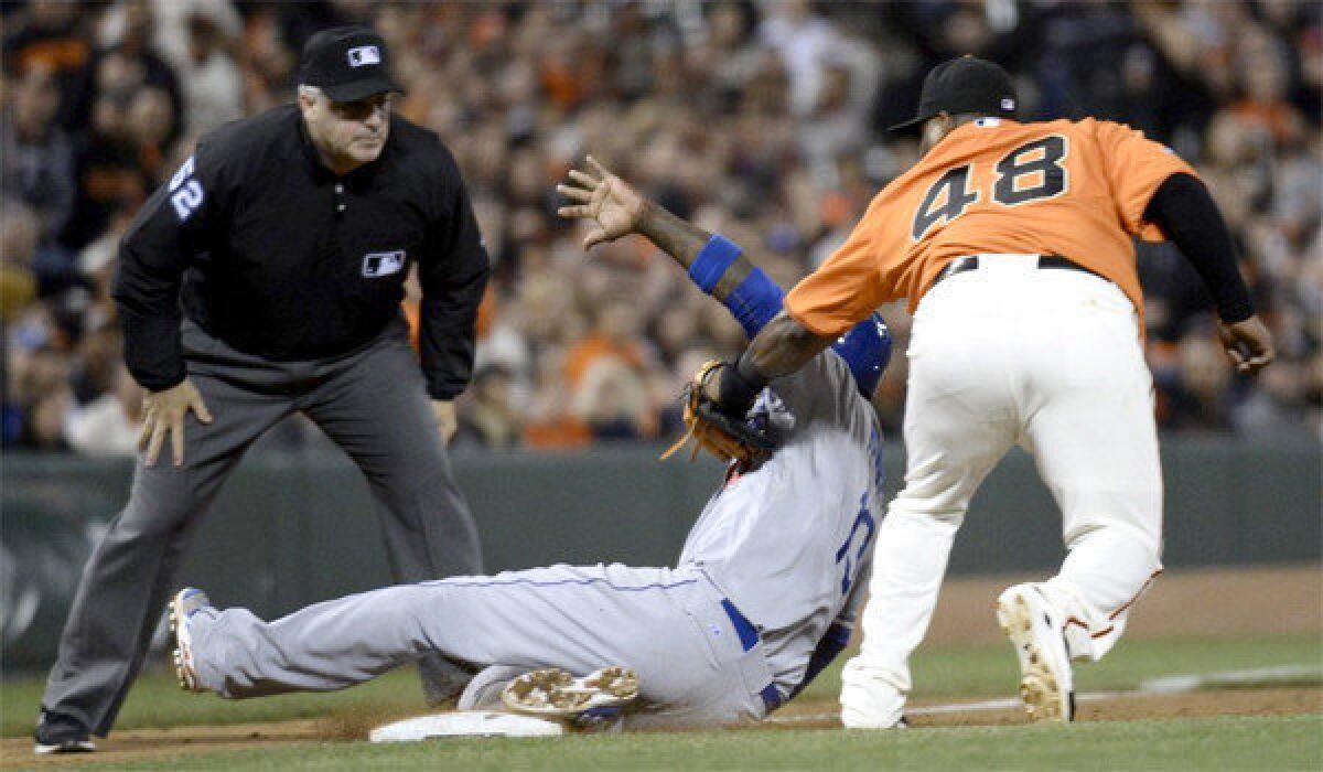 Dodgers shortstop Hanley Ramirez suffered an injury to his left hamstring after trying to turn a base hit single into a triple during the opening game of a series with the San Francisco Giants on Friday.