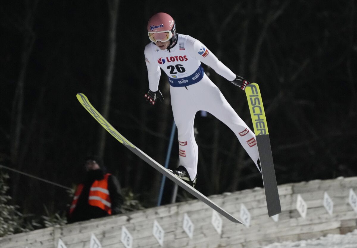 Jan Hoerl of Austria in action during the team competition of the FIS Ski Jumping World Cup Ski Jump, in Wisla, Poland, Sunday, Dec. 5, 2021. (AP Photo/Czarek Sokolowski)