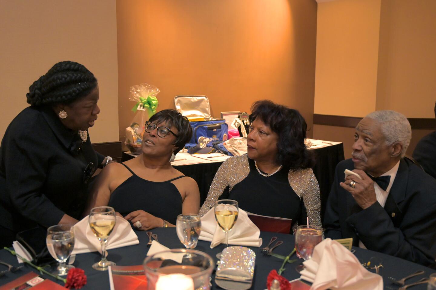 Mae A. Beale, Christine Fields, Regina Cook, and Stephen Cook at the Kappa Alpha Psi Scholarship Foundation of Columbia's Black & White Soirée.
