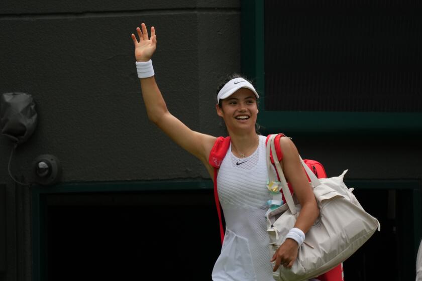 Britain's Emma Raducanu acknowledges the crowd after she beat Romania's Sorana Cirstea at Wimbledon on July 3, 2021.