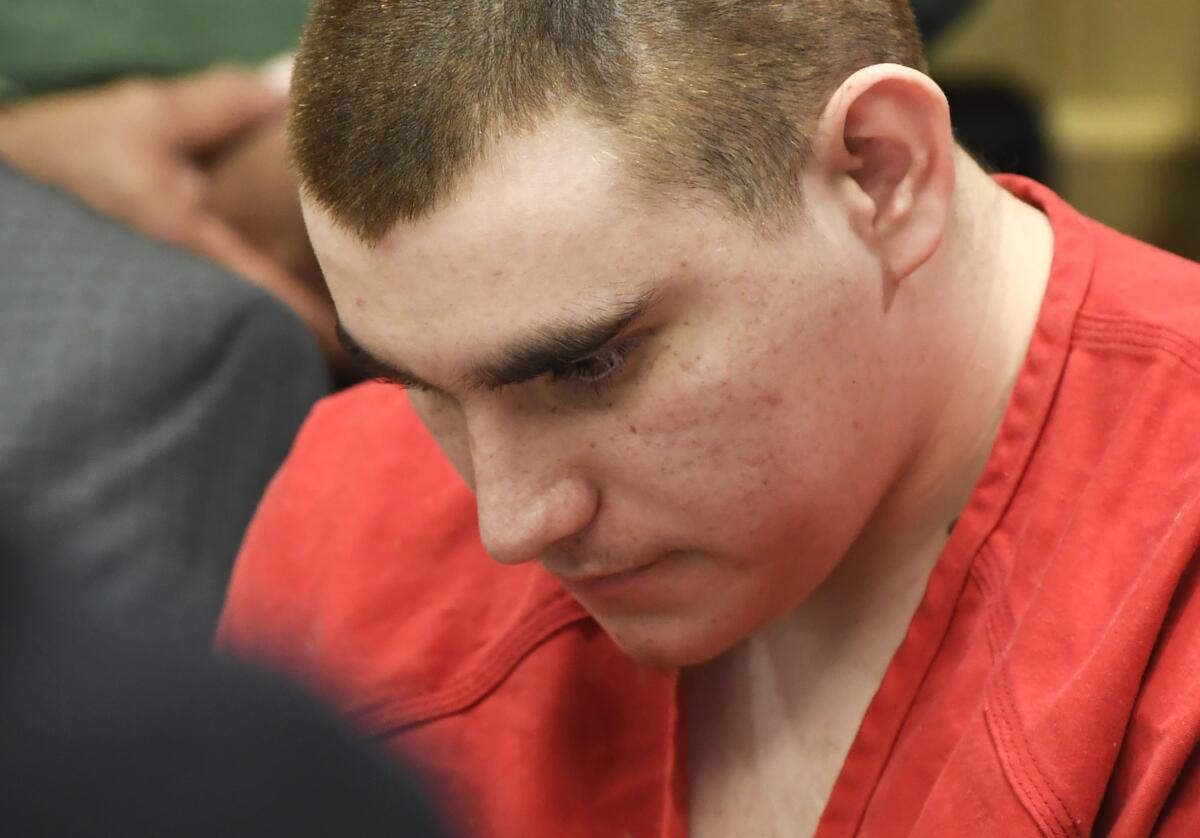 FILE - In this June 8, 2018, file photo, school shooting suspect Nikolas Cruz sits in the Broward County courthouse in Fort Lauderdale, Fla. In a motion filed Thursday, July 8, 2021, attorneys for Cruz, accused of killing 17 people at a Florida high school in 2018, want a judge to close all future hearings to the media and the public to ensure a fair trial. (Taimy Alvarez/South Florida Sun-Sentinel via AP, Pool, File)