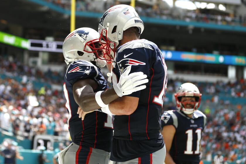 MIAMI, FLORIDA - SEPTEMBER 15: Antonio Brown #17 of the New England Patriots celebrates with Tom Brady #12 after scoring a touchdown against the Miami Dolphins during the second quarter in the game at Hard Rock Stadium on September 15, 2019 in Miami, Florida. (Photo by Michael Reaves/Getty Images)