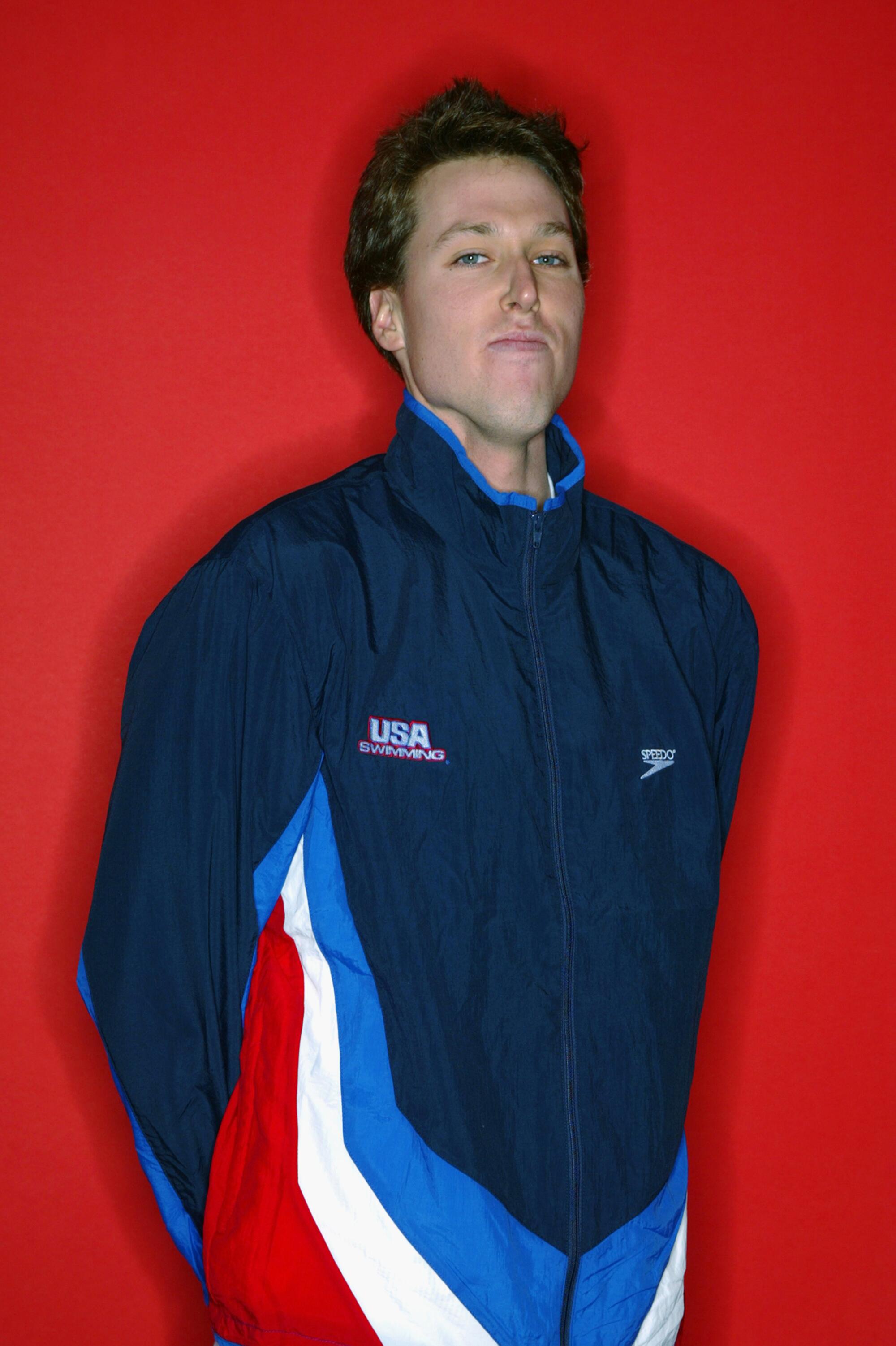 Klete Keller in a USA outfit stands before a red background