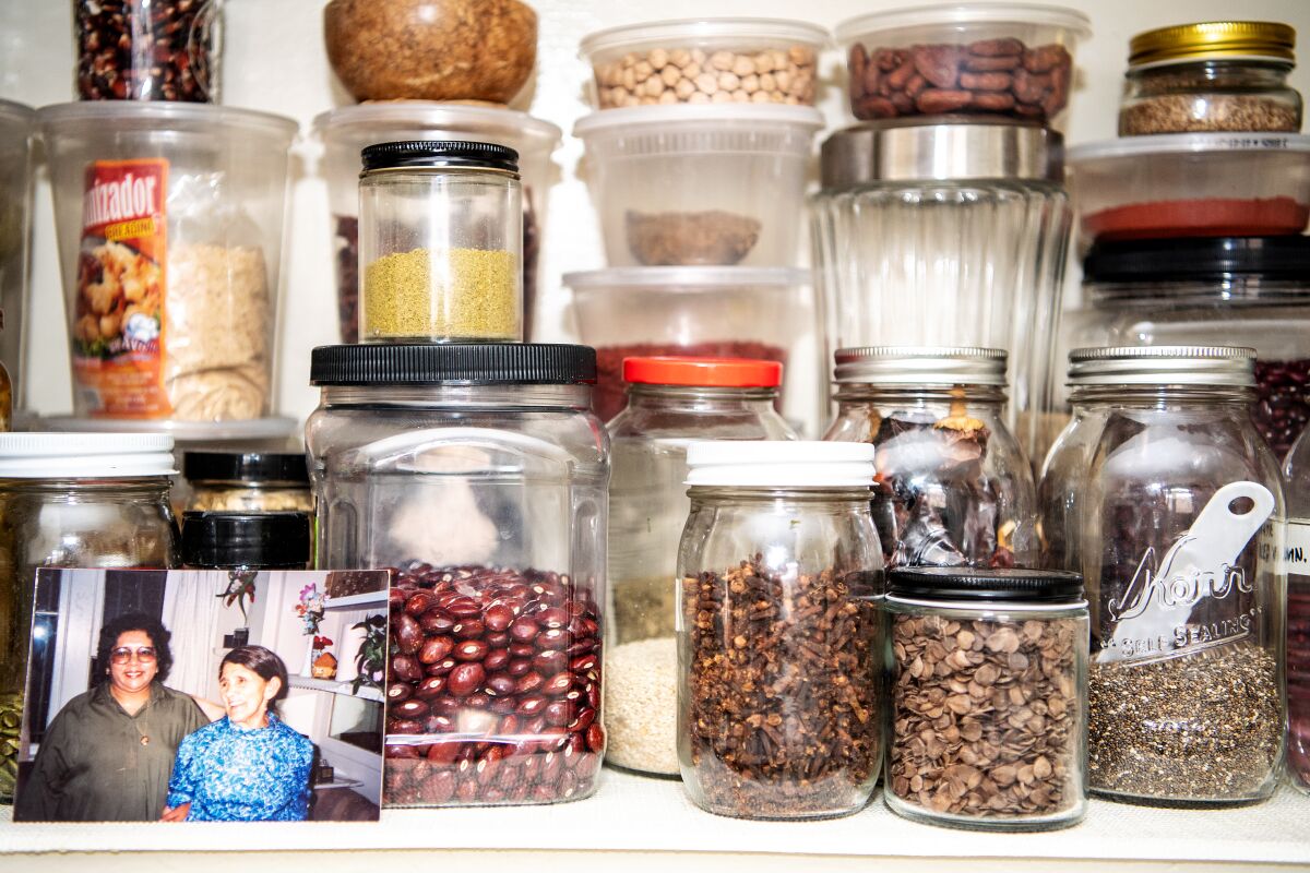 Spices and a family photo in the kitchen of food writer and online cooking instructor Karla Vasquez.