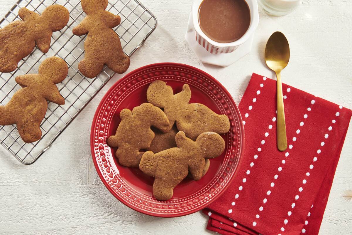 Gingerbread cookies on a red plate. 
