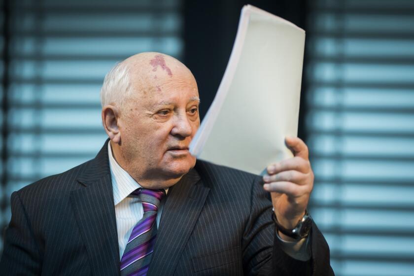 Former Soviet Union leader Mikhail Gorbachev speaks at a symposium Saturday on security in Europe 25 years after the fall of the "Wall" in Berlin.