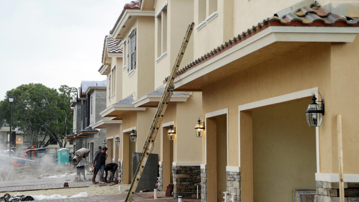 Town homes are under construction in Tamarac, Fla., on Thursday. One thing weighing on home sales is a lack of homes available.