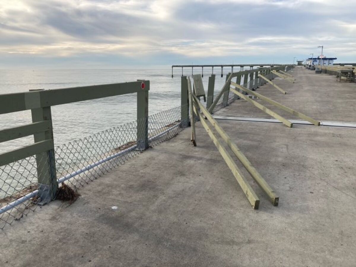 Broken pier railings caused by high surf have closed the Ocean Beach Pier since January.