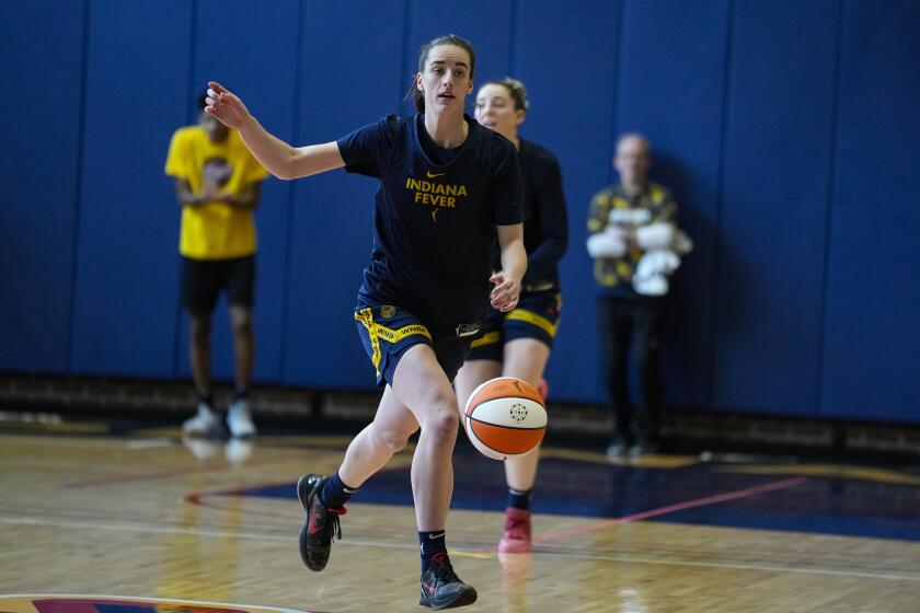Indiana Fever guard Caitlin Clark brings the ball upcourt as the WNBA basketball team practices in Indianapolis, Sunday, April 28, 2024. (AP Photo/Michael Conroy)