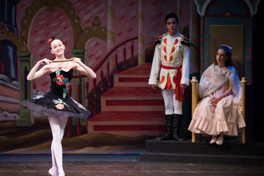 Misha MacGowan, left, dancing as a Mirliton in the Southern California Ballet’s 2021 production of “The Nutcracker.”