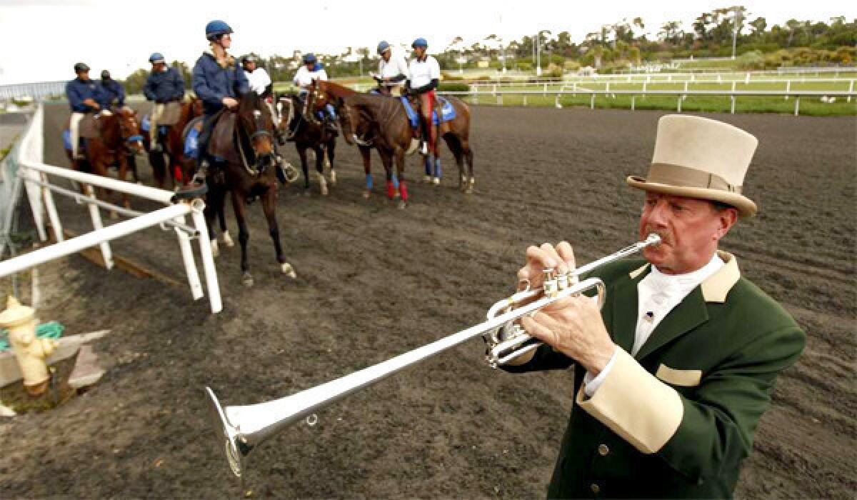Jay Cohen blows on the Herald trumpet to call the horses to the track for his 25th year on April 26, 2012 at the opening day at Betfair Hollywood Park.