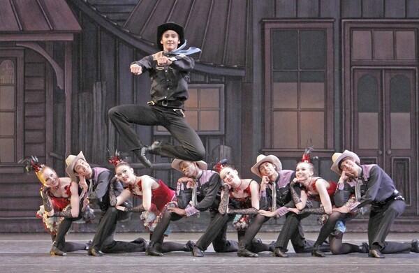 Dancer Christopher Revels leaps through the air in the piece "Western Symphony" at the Alex Theatre in Glendale.