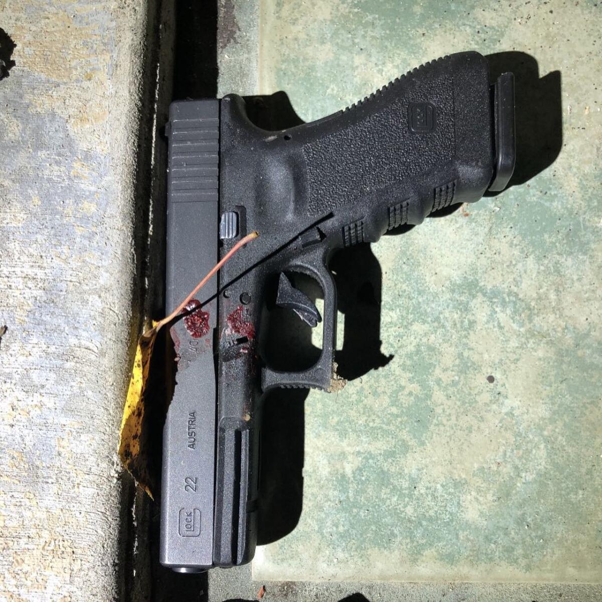This handgun was found near a man shot and killed by Seal Beach police Monday.