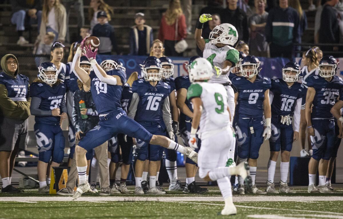 Newport Harbor's Aidan Goltz catches a pass on the sideline against Monrovia in the quarterfinals of the CIF Southern Section Division 9 playoffs on Nov. 15.