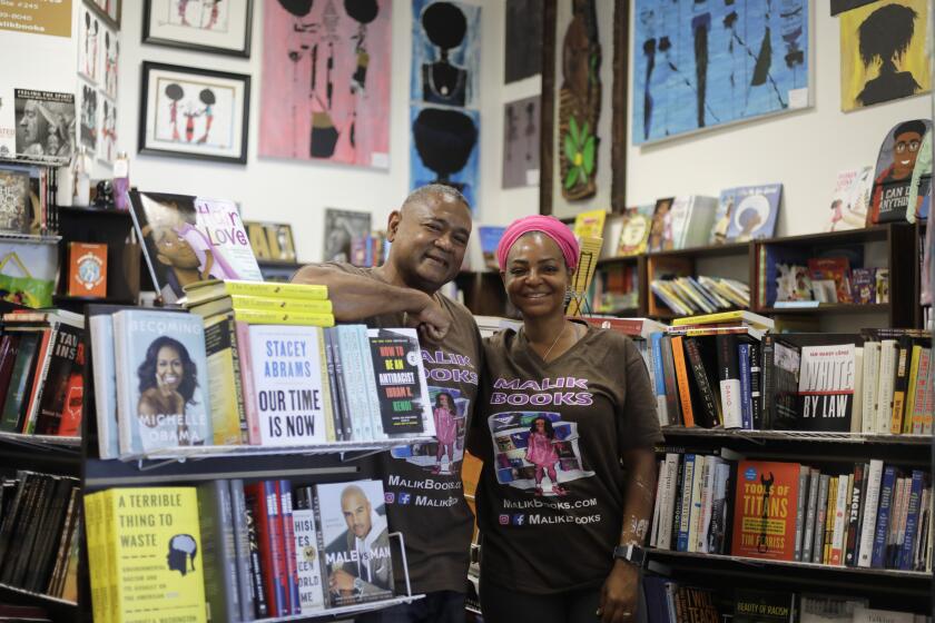 LOS ANGELES, CA - JULY 14: Malik and April Muhammad (cq) of Malik Books want to "change minds to bring change" through their bookstore in Los Angeles that celebrates the African American experience, culture and pride. (Myung J. Chun / Los Angeles Times)
