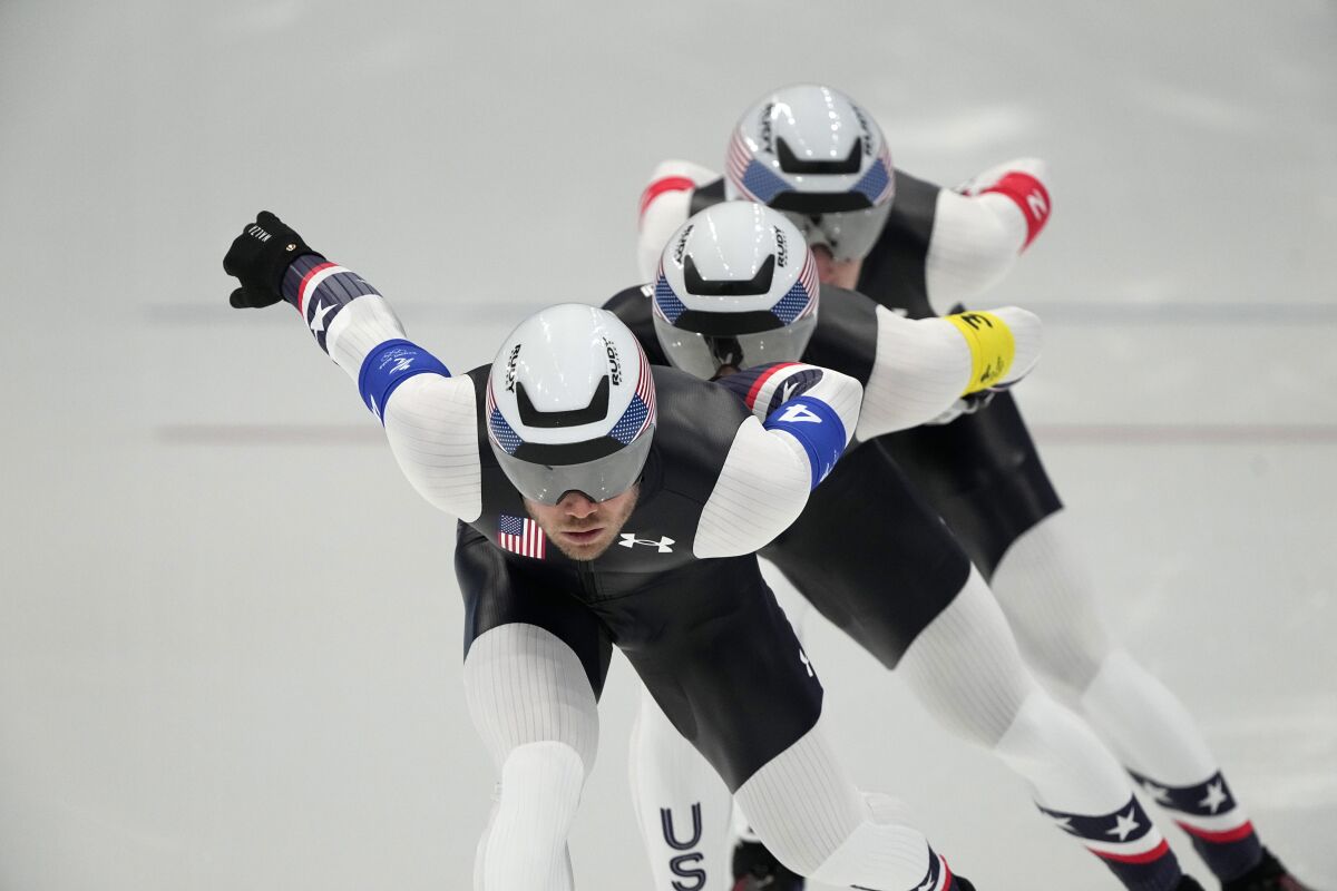 Team United States, led by Joey Mantia, with Emery Lehman center and Casey Dawson, competes during the speedskating men's team pursuit finals at the 2022 Winter Olympics, Tuesday, Feb. 15, 2022, in Beijing. (AP Photo/Ashley Landis)