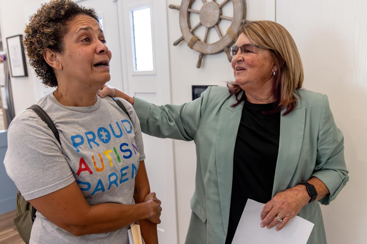 Christine Lyburtus visiting a care facility