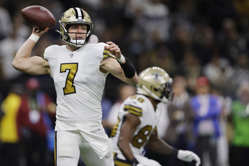 New Orleans Saints quarterback Taysom Hill (7) works in the pocket against the Dallas Cowboys during the first half of an NFL football game, Thursday, Dec. 2, 2021, in New Orleans. (AP Photo/Brett Duke)