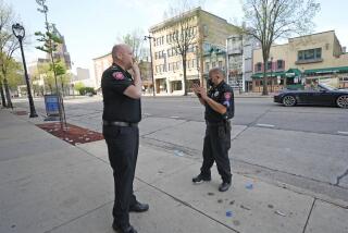 MSOE Public Safety officers investigate the scene of a shooting near the corner of North Water Street and East Juneau Avenue in Milwaukee, Saturday, May 14, 2022, where multiple were shot and injured late Friday in Milwaukee's downtown bar district after the Milwaukee Bucks playoff game. Authorities say multiple people were injured in two shootings in downtown Milwaukee near an entertainment district where thousands of people were watching the Bucks play the Celtics in the NBA’s Eastern Conference semifinals. (Mike De Sisti/Milwaukee Journal-Sentinel via AP)