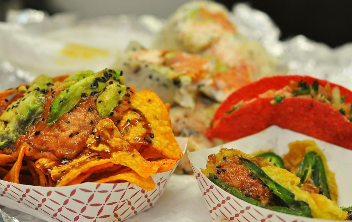 A selection of items from the Jogasaki burrito truck, including the spicy tuna nachos (left), sushi burritos, sashimi taco and jalapeno poppers.