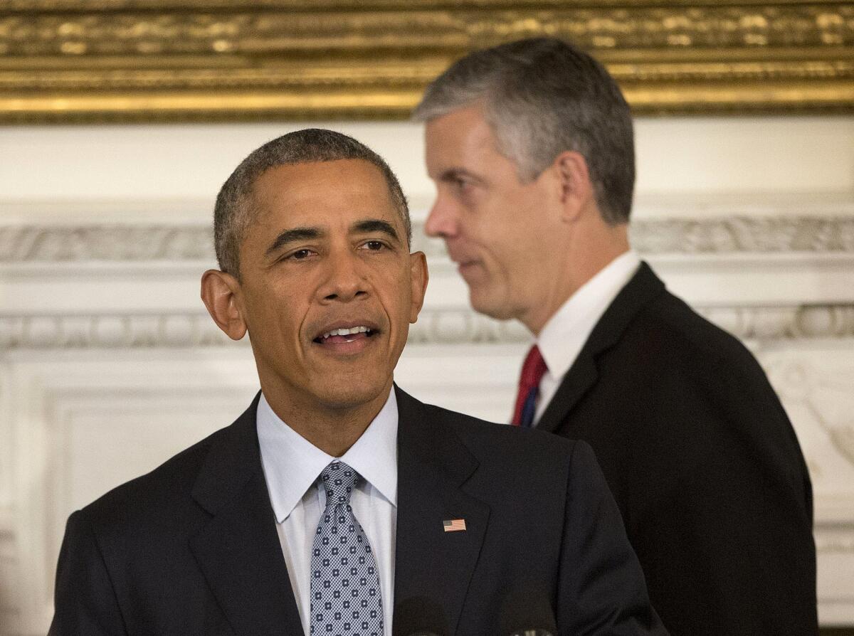 President Obama and Education Secretary Arne Duncan arrive in the State Dining Room of the White House in Washington on Oct. 2.
