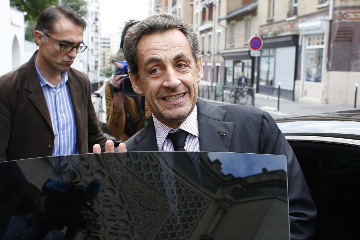 Former French President Nicolas Sarkozy leaves Paris' Great Mosque after attending a lunch with the rector.
