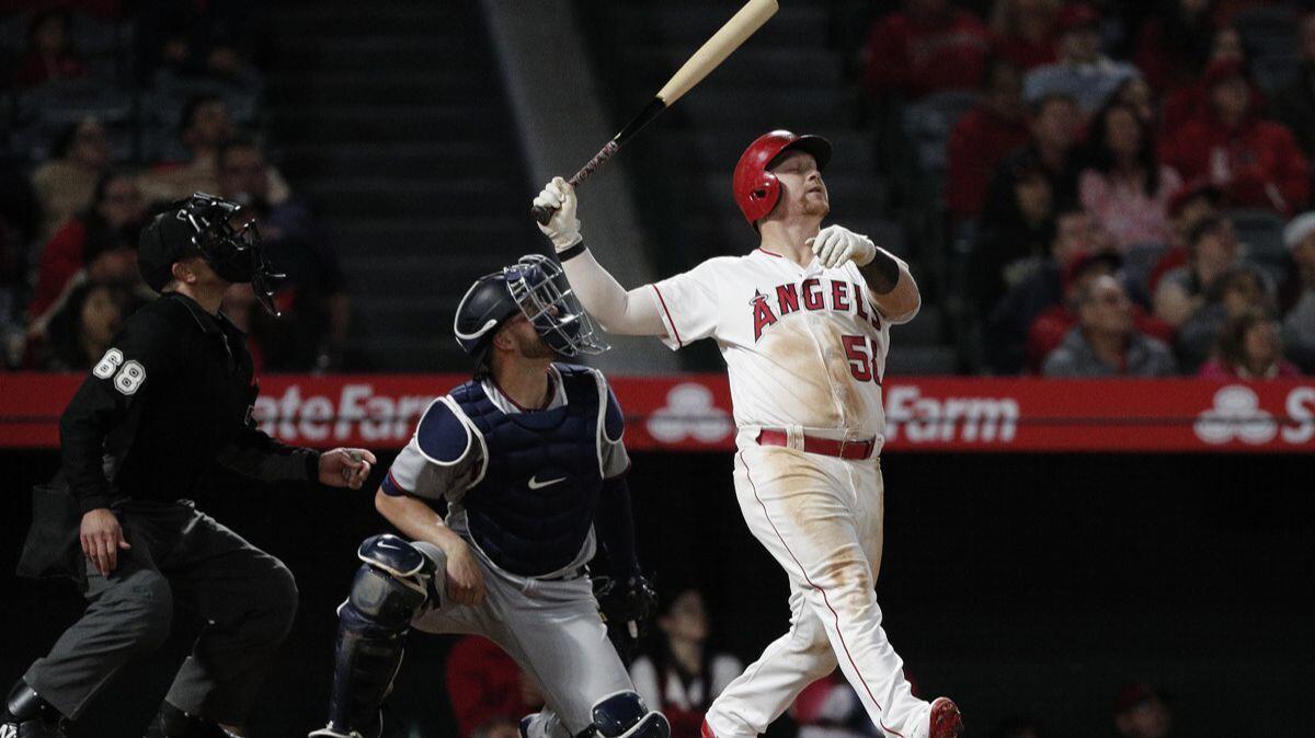 Angels right fielder Kole Calhoun reacts as he flies out to left field with a runner on base and the game tied 3-3 against the Minnesota Twins in the 10th inning at Angel Stadium on Saturday.
