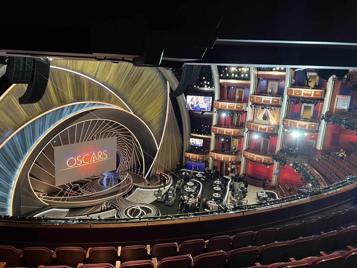 A view from the balcony of an elaborate stage with a screen that says "Oscars."