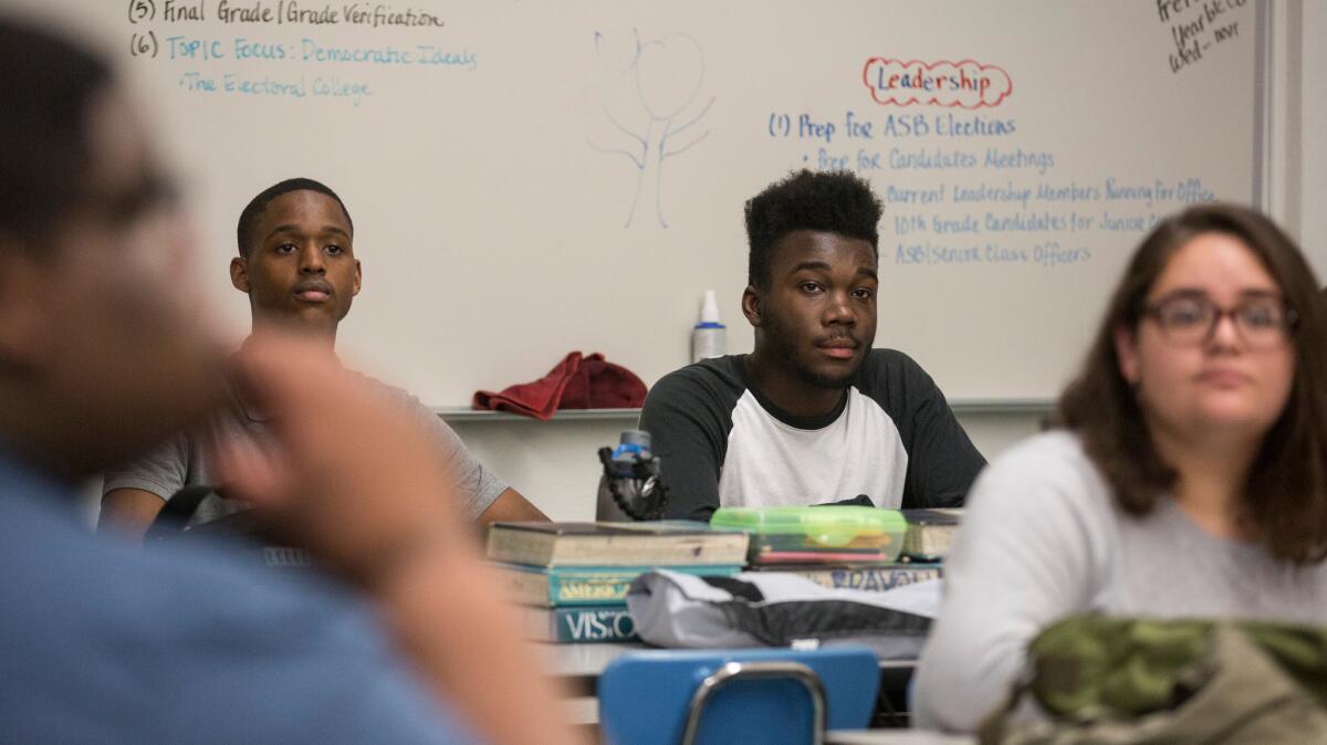 Washington Prep High School freshman Damion Lester, who has been scouted already by UCLA, listens in his leadership class in Los Angeles, Calif.,