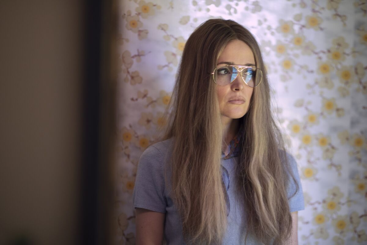 A woman in sunglasses and long hair